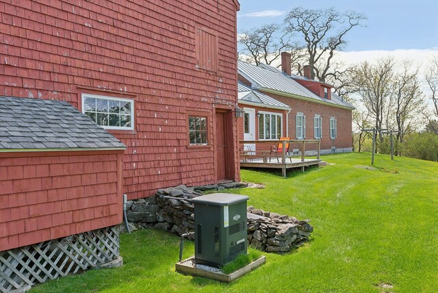 538 Malbons Mills Rd, Skowhegan, ME 04976 - view of side of home with a deck and a yard
