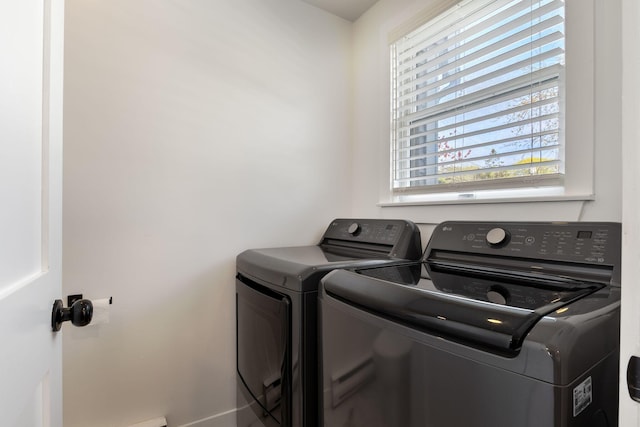 15 Francis St Unit 10, Old Orchard Beach, ME 04064 - clothes washing area with washer and clothes dryer and baseboards
