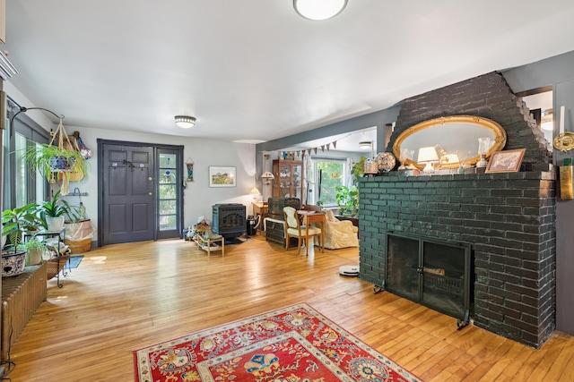 176 Second St, Auburn, ME 04210 - living room with hardwood / wood-style floors and a brick fireplace