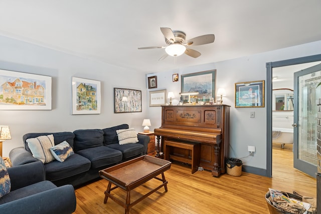 176 Second St, Auburn, ME 04210 - living room featuring light wood-style flooring and a ceiling fan
