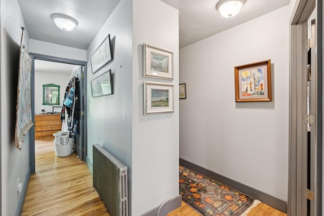 176 Second St, Auburn, ME 04210 - corridor featuring radiator and light wood-style flooring