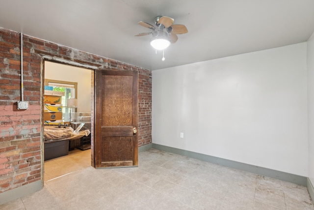 176 Second St, Auburn, ME 04210 - unfurnished room featuring a ceiling fan and brick wall
