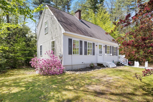 212 New Dam Rd, Waterboro, ME 04061 - view of front of property featuring a chimney, a front yard, and roof with shingles