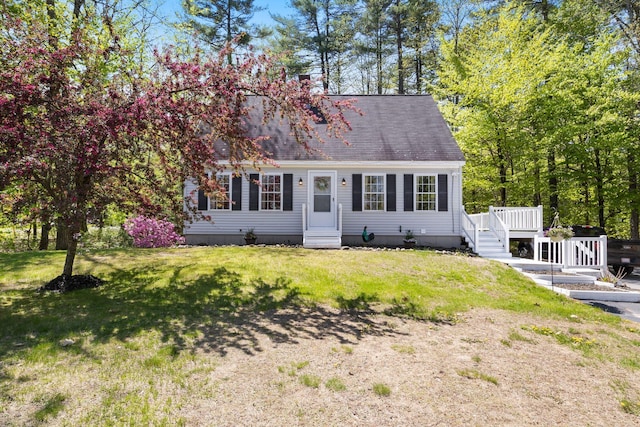 212 New Dam Rd, Waterboro, ME 04061 - cape cod-style house featuring a deck, a front lawn, entry steps, and a shingled roof