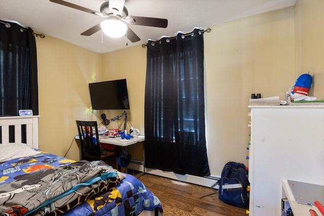 212 New Dam Rd, Waterboro, ME 04061 - bedroom with wood finished floors, a baseboard radiator, and ceiling fan