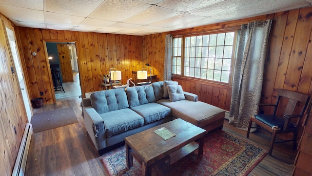 19 Russell St, Bangor, ME 04401 - living area with a baseboard radiator, hardwood / wood-style flooring, and wooden walls