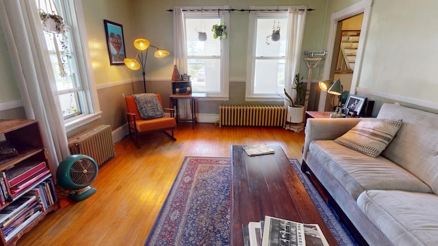 19 Russell St, Bangor, ME 04401 - living room with radiator heating unit, hardwood / wood-style floors, and baseboards