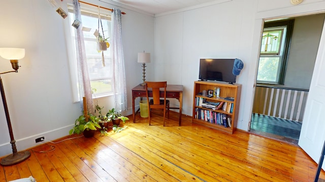 19 Russell St, Bangor, ME 04401 - sitting room with hardwood / wood-style flooring, healthy amount of natural light, crown molding, and baseboards