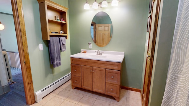 19 Russell St, Bangor, ME 04401 - bathroom featuring a baseboard radiator, vanity, tile patterned floors, and baseboards