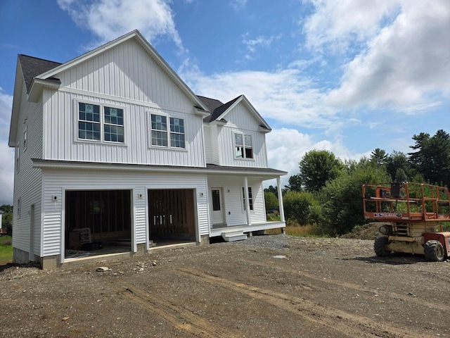 LOT3 Hawks Xing, Hermon, ME 04401 - modern farmhouse style home featuring board and batten siding, covered porch, driveway, and an attached garage