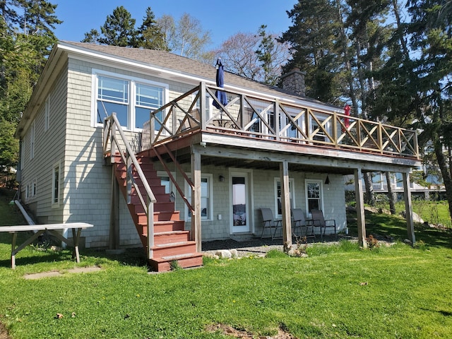 21 Linekin Rd, Boothbay Harbor, ME 04538 - back of property with a wooden deck, a yard, a chimney, and a shingled roof