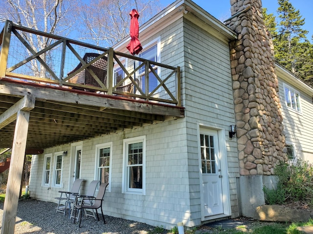 21 Linekin Rd, Boothbay Harbor, ME 04538 - rear view of house with a chimney and a deck
