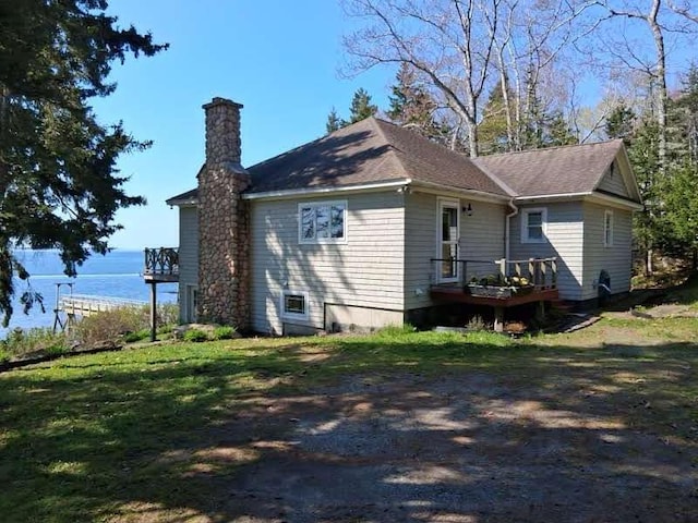 21 Linekin Rd, Boothbay Harbor, ME 04538 - view of property exterior with a chimney and a wooden deck