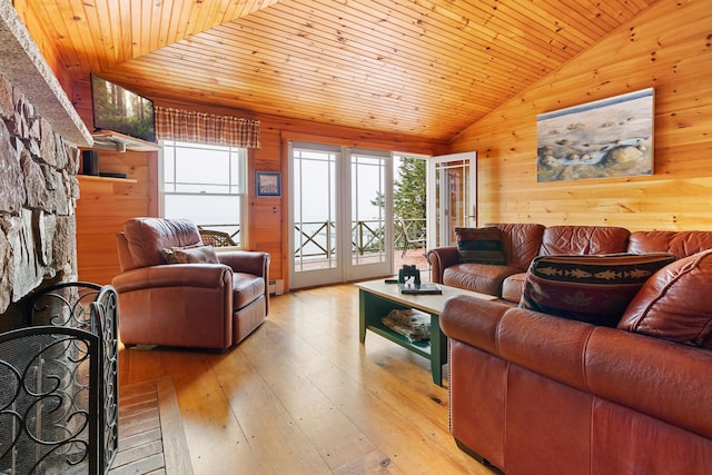 21 Linekin Rd, Boothbay Harbor, ME 04538 - living area featuring wood walls, plenty of natural light, lofted ceiling, wood ceiling, and light wood-style floors