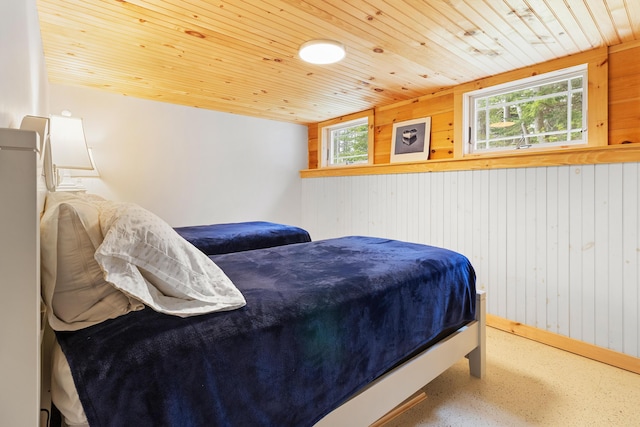 21 Linekin Rd, Boothbay Harbor, ME 04538 - bedroom with wood walls, wooden ceiling, and baseboards
