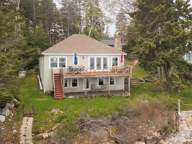 21 Linekin Rd, Boothbay Harbor, ME 04538 - back of house featuring a deck, a chimney, stairs, roof with shingles, and a lawn