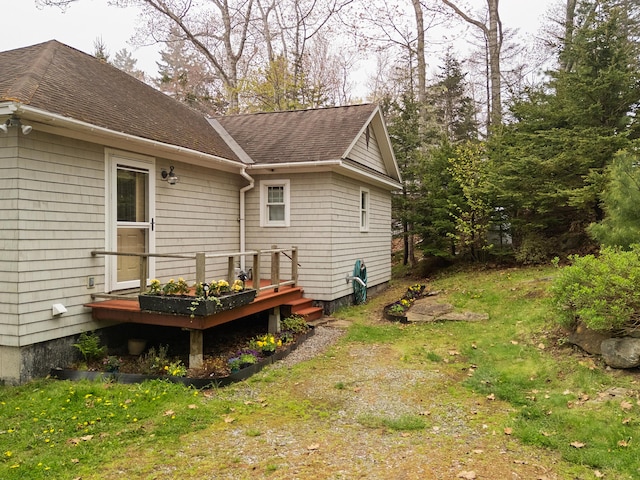 21 Linekin Rd, Boothbay Harbor, ME 04538 - view of side of home with a shingled roof and a wooden deck