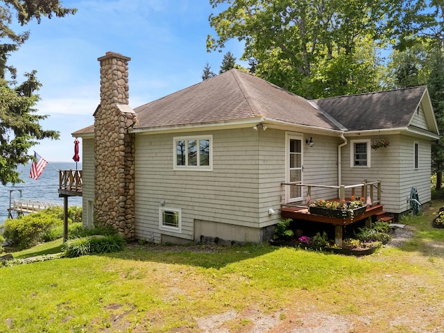21 Linekin Rd, Boothbay Harbor, ME 04538 - rear view of house featuring roof with shingles, a chimney, a deck, and a yard