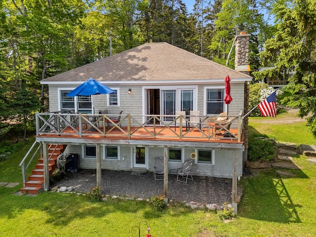 21 Linekin Rd, Boothbay Harbor, ME 04538 - rear view of property featuring a shingled roof and a yard