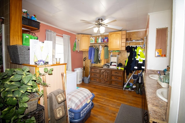 bedroom featuring crown molding, wood finished floors, and wooden walls