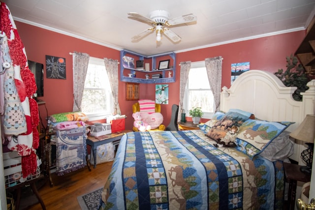 bedroom featuring crown molding, wood finished floors, multiple windows, and a ceiling fan
