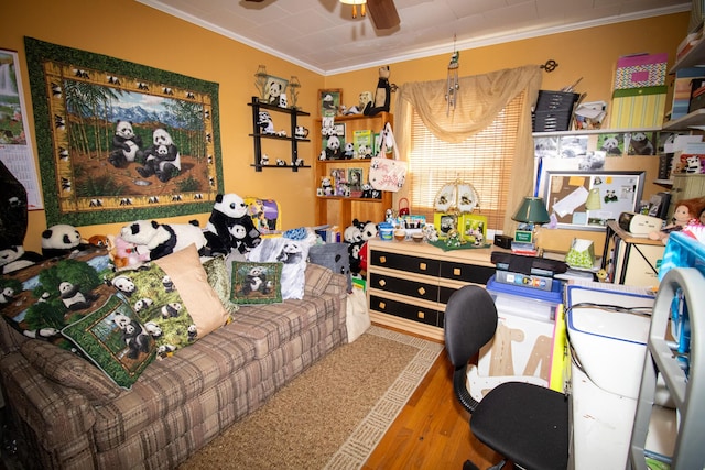 office area featuring ornamental molding, a ceiling fan, and wood finished floors