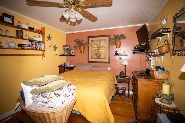 bedroom featuring wood finished floors and ornamental molding