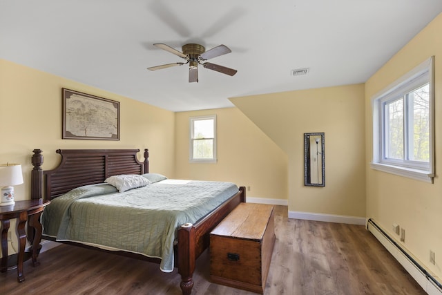 17 Westview Rd, Damariscotta, ME 04543 - bedroom featuring a baseboard radiator, wood finished floors, baseboards, and a ceiling fan