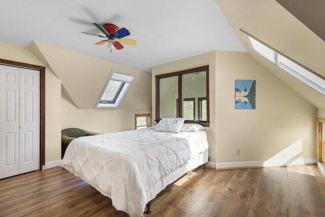 17 Westview Rd, Damariscotta, ME 04543 - bedroom with a skylight, lofted ceiling, wood finished floors, baseboards, and a ceiling fan