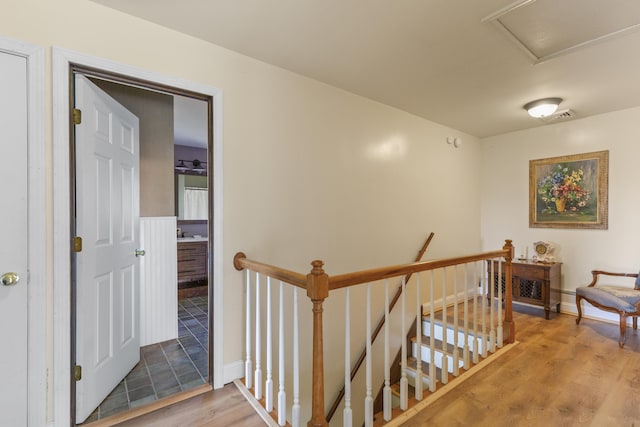 17 Westview Rd, Damariscotta, ME 04543 - hallway with an upstairs landing, light wood-type flooring, attic access, and baseboards