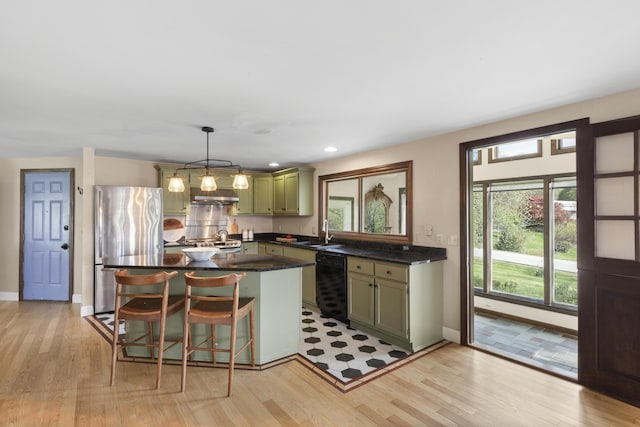 17 Westview Rd, Damariscotta, ME 04543 - kitchen featuring freestanding refrigerator, dishwasher, green cabinetry, a sink, and light wood-style floors
