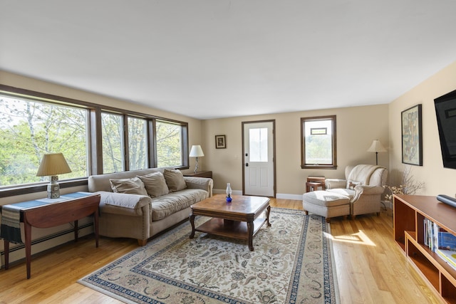 17 Westview Rd, Damariscotta, ME 04543 - living area featuring light wood-type flooring and a baseboard heating unit