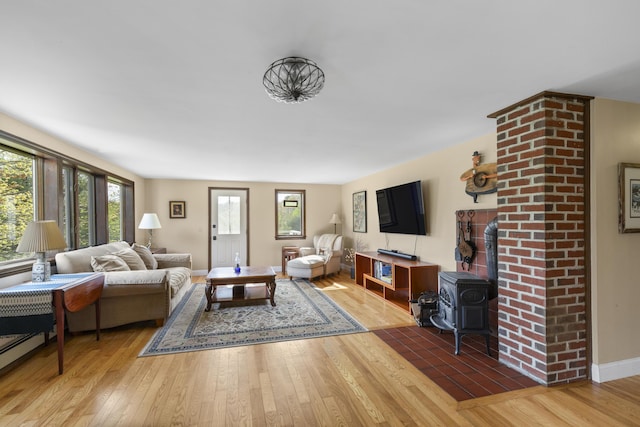 17 Westview Rd, Damariscotta, ME 04543 - living room with hardwood / wood-style flooring, healthy amount of natural light, and a wood stove