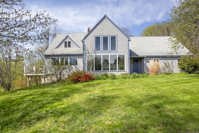 17 Westview Rd, Damariscotta, ME 04543 - back of property featuring a chimney, a lawn, and roof with shingles