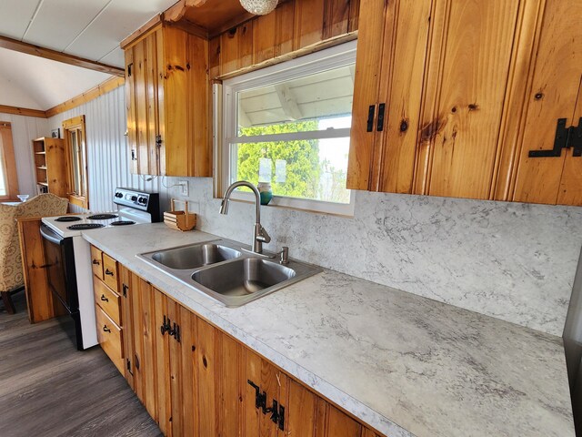 61 W Shore Rd, Harpswell, ME 04079 - kitchen with range with electric cooktop, a sink, brown cabinets, plenty of natural light, and vaulted ceiling