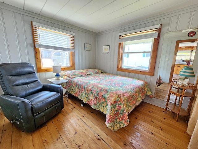 61 W Shore Rd, Harpswell, ME 04079 - bedroom with multiple windows and light wood finished floors