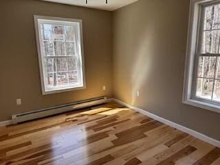 29 Sunnybrook Farm Rd, Bridgton, ME 04009 - unfurnished room featuring healthy amount of natural light, a baseboard radiator, wood finished floors, and baseboards