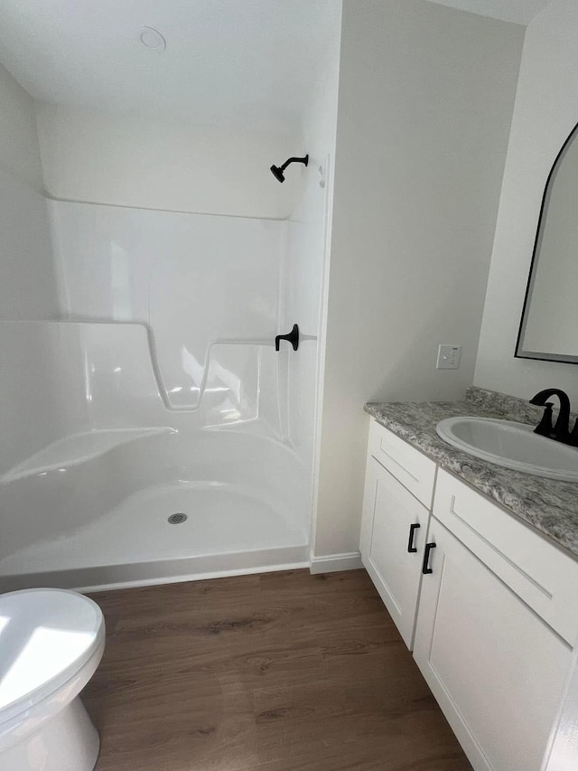 29 Sunnybrook Farm Rd, Bridgton, ME 04009 - bathroom with vanity, a shower, wood finished floors, and toilet
