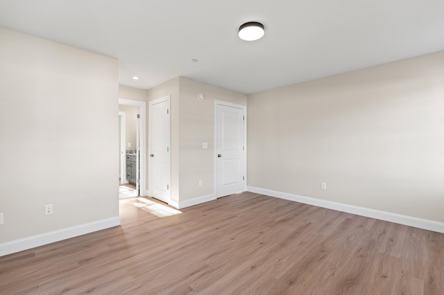 32 Jackson St, Portland, ME 04103 - unfurnished room featuring baseboards, light wood-style floors, and recessed lighting