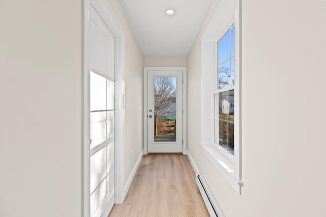 32 Jackson St, Portland, ME 04103 - doorway featuring light wood-style flooring and baseboards