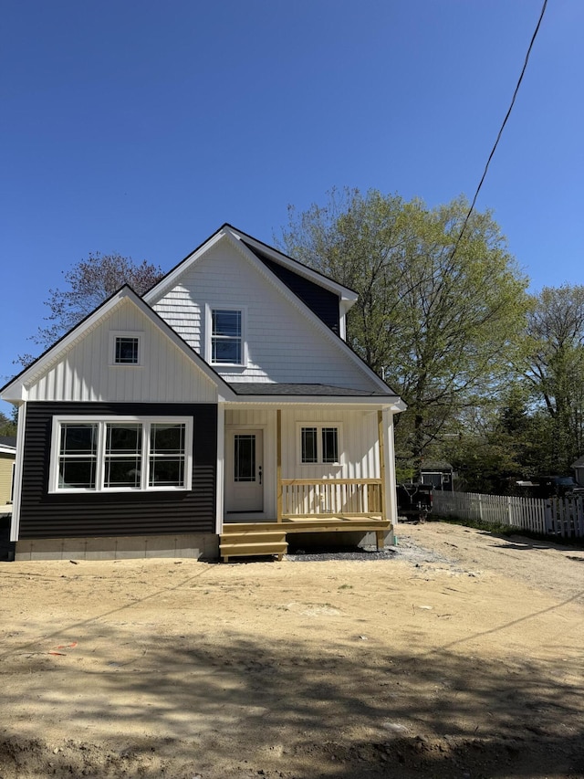 32 Jackson St, Portland, ME 04103 - view of front of home with a porch, fence, and board and batten siding