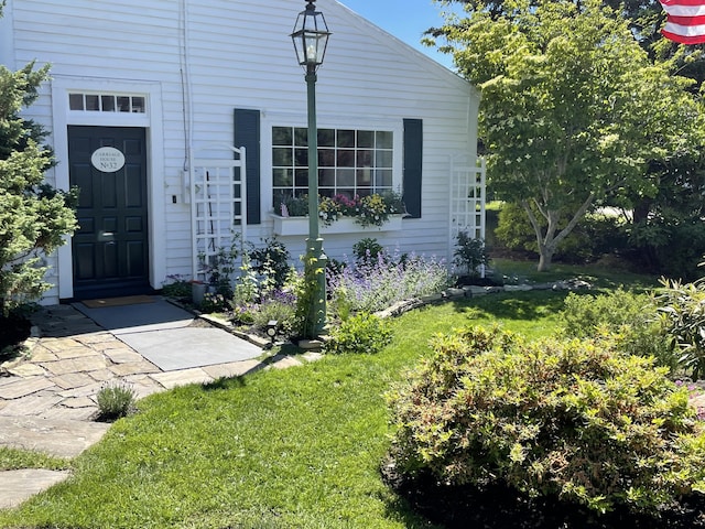 32 Murray Hill Rd, Boothbay, ME 04544 - property entrance featuring a lawn