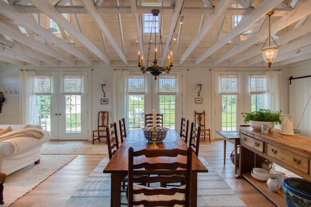 32 Murray Hill Rd, Boothbay, ME 04544 - dining space featuring french doors, healthy amount of natural light, light wood-style flooring, and wood walls