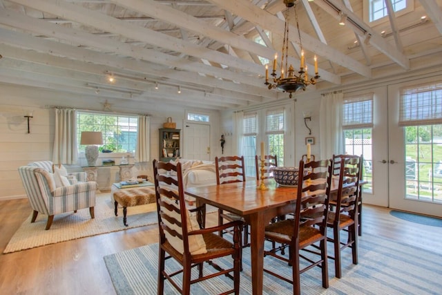 32 Murray Hill Rd, Boothbay, ME 04544 - dining space featuring french doors, light wood finished floors, and plenty of natural light