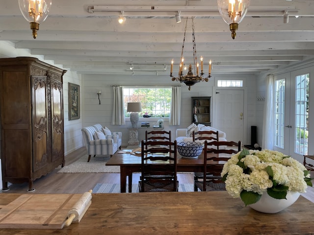 32 Murray Hill Rd, Boothbay, ME 04544 - dining space featuring track lighting, light wood-type flooring, a chandelier, and beam ceiling