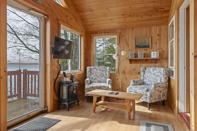 33 Bernier Ln, Harpswell, ME 04079 - sunroom / solarium featuring a wood stove and vaulted ceiling
