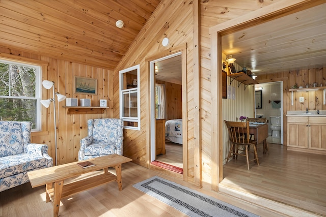 33 Bernier Ln, Harpswell, ME 04079 - sitting room featuring lofted ceiling, wood walls, wood finished floors, and wood ceiling