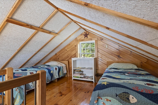 33 Bernier Ln, Harpswell, ME 04079 - bedroom with wood-type flooring, lofted ceiling, and wood walls