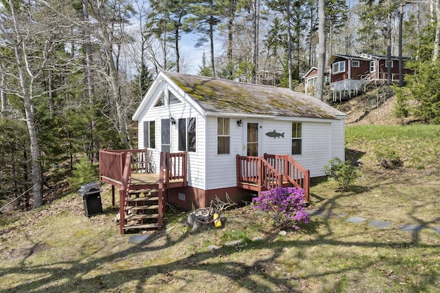 33 Bernier Ln, Harpswell, ME 04079 - view of front of home featuring a wooden deck and roof with shingles