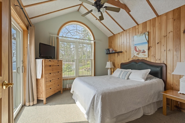 33 Bernier Ln, Harpswell, ME 04079 - bedroom featuring carpet floors, multiple windows, wood walls, vaulted ceiling, and ceiling fan